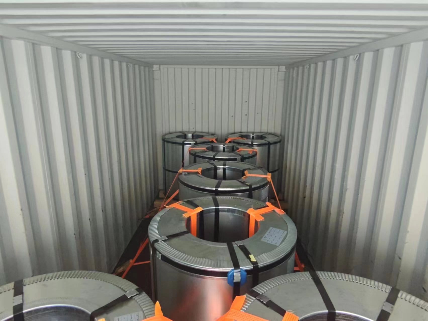 Coils loaded and strapped inside a shipping container