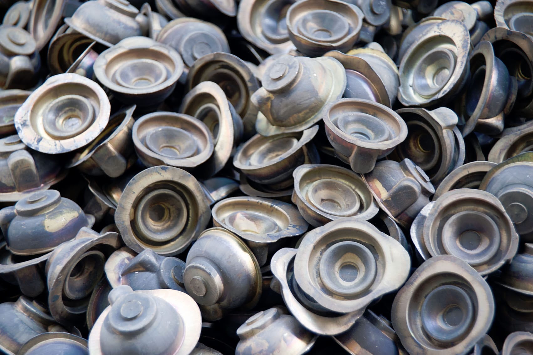Pressed metal transformer caps